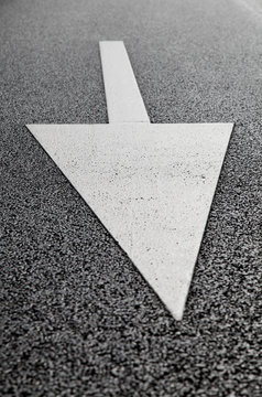 asphalt road with arrow