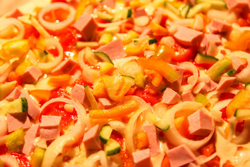 Pizza with tomatoes, onion and meat raw ingredients