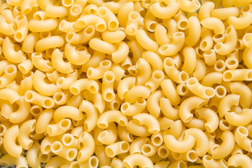 background of raw pasta in the shape of horns