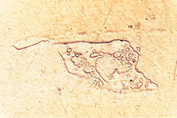 Vintage yellow background. Rough painted wall of aspen gold color. Imperfect plane of golden colored. Uneven old decorative toned backdrop of yellow tint. Texture of gold hue. Ornamental stony surface