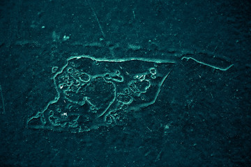 Vintage azure background. Rough painted wall of turquoise color. Imperfect plane of cyan colored. Uneven old decorative toned backdrop of aqzure tint. Texture of teal hue. Ornamental stony surface.