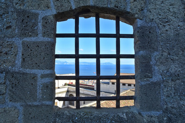 Panorama of Naples from the bars of an old prison