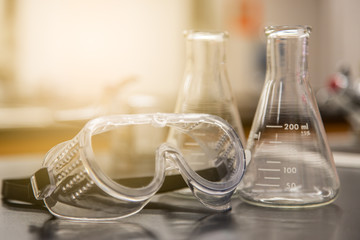 Collection of scientific equipment organized upon a counter within a brightly lit lab