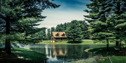 A beautiful home next to a lake on a summer day in Indiana, USA
