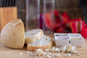 Sliced rustic bread with sauces for dipping