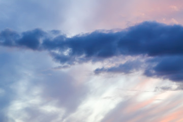 Beautiful cloudscape with blue sky and bright clouds at sunset in summer.
