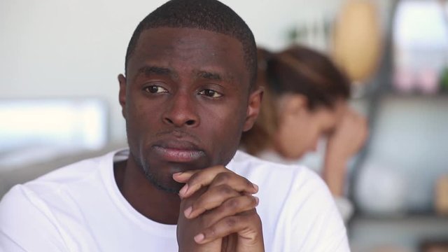 Sad thoughtful african american man upset after fight with girlfriend