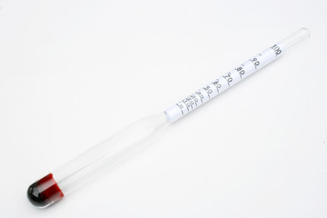 Thermometer and alcohol meter at the white background