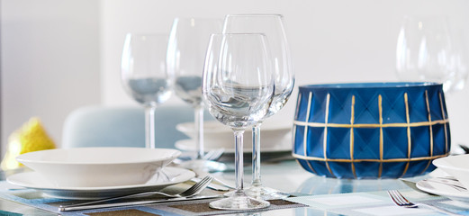 Table appointment setting at restaurant fragile wine or water glasses and plates