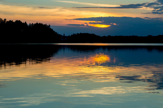 Beautiful sunset reflecting on a lake © Alexander_photo