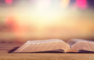 Open Holy bible book on background