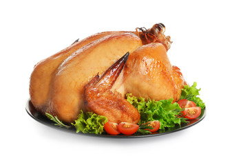 Platter of cooked turkey with garnish on white background