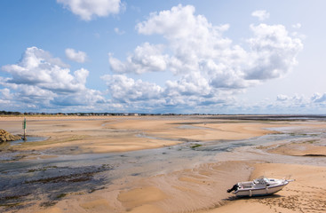 The boat in Carteret harbor at low tide. Barneville-Carteret, Normandy, France