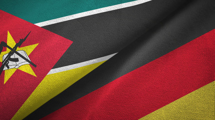 Fototapeta premium Mozambique and Germany two flags textile cloth, fabric texture