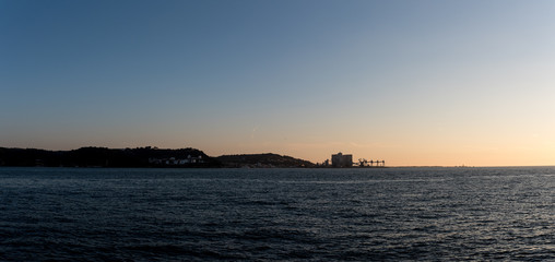 mouth of the Tagus river, lisbon, portugal, on sunset