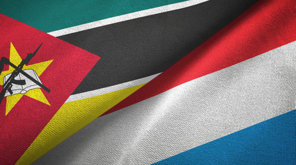 Mozambique and Luxembourg two flags textile cloth, fabric texture