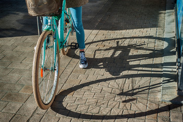 Naklejka premium walking around the city with a bicycle. a Dutch bicycle with a shadow falling beautifully from it onto the pavement