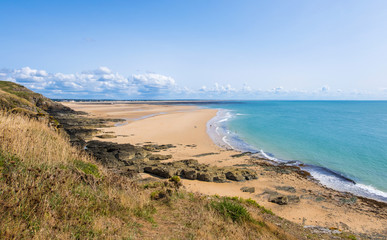 Fototapeta na wymiar Rocky coast and beach on the Cape Carteret. Normandy, France