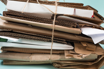 Recycling paper. Separate waste collection. Muculature Cardboard and paper folded