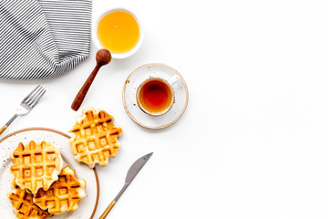 homemade Belgian waffles on served table on white background top view space for text
