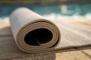 Yoga mat by the pool