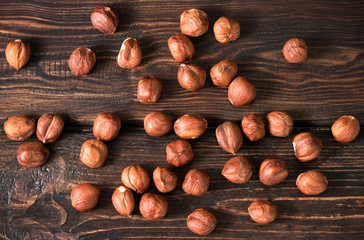 .hazelnuts top on wooden background