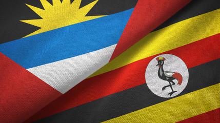 Fototapeta premium Antigua and Barbuda and Uganda two flags textile cloth, fabric texture