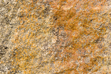 Background of granite. Texture of granite stone. Pattern of roughened surface. Texture of brown stone