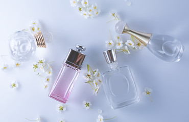 different small bottles of perfume with flowers