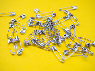 Lots of safety pins. Team concept