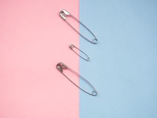 Fototapeta premium Several safety pins representing an unconventional family of gay, lesbian or transgender