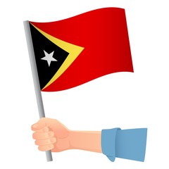 East Timor flag in hand