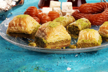 Middle eastern or arabic dishes. Turkish Dessert Baklava with pistachio on dishes