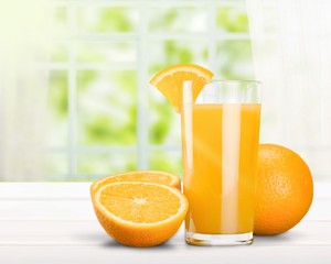 Glass of delicious orange juice on natural