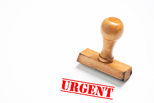 Rubber stamp with  urgent sign on white background.