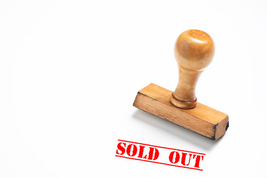 Rubber stamp with sold out sign on white background.