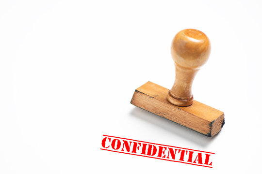 Rubber stamp with confidential  sign on white background.