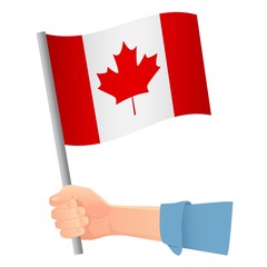 Fototapeta na wymiar Canada flag in hand