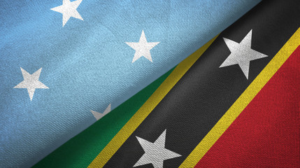 Micronesia and Saint Kitts and Nevis two flags textile cloth, fabric texture