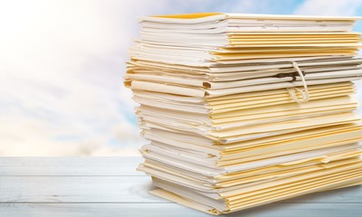 File folders with documents isolated on white background