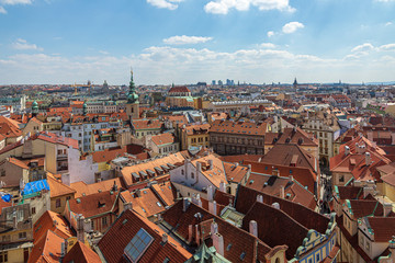 Fototapeta na wymiar Aerial panoramic top view above old town and city skyline with famous attraction; Church of St. Gallen and Church of Our Lady of the Snows against blue sky on sunny day in Prague, Czech Republic.