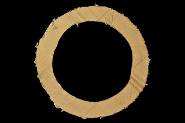 Brown and beige colored corrugated cardboard. Rounded cut. Coarse, freight. Industrial, backdrop. Isolated on black background