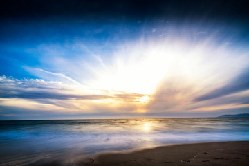 Obraz na płótnie Canvas Sunset over the Beach in the Afternoon