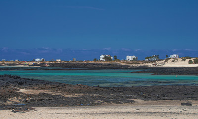turquoise sea set among the black volcanic rock of Fuerteventura. Canary Islands - Spain