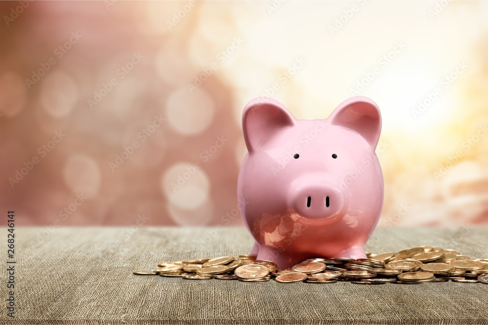 Poster Hand Putting a Coin in Piggy Bank