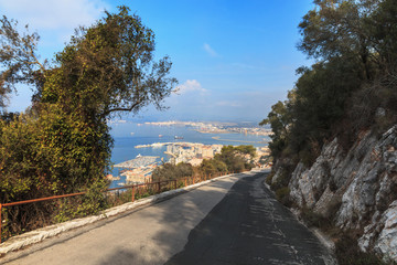Road downhill on the edge of The Rock cliff, Gibraltar summer season