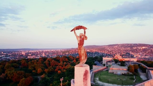 Aerial footage by the liberty statue of Budapest, Hungary, with a general view the city.