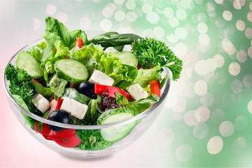 Closeup of Greek salad with feta cheese, cherry tomatoes and lettuce