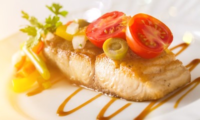 Tasty salmon on plate isolated
