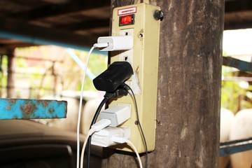 Plug a lot of phone cables into the old electrical outlet